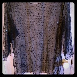 Airy point d’esprit sheer blouse.